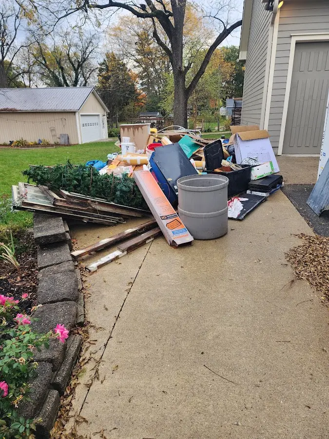 Dumpster being loaded with debris for 3 Yard Dumpster Rental in West Chester